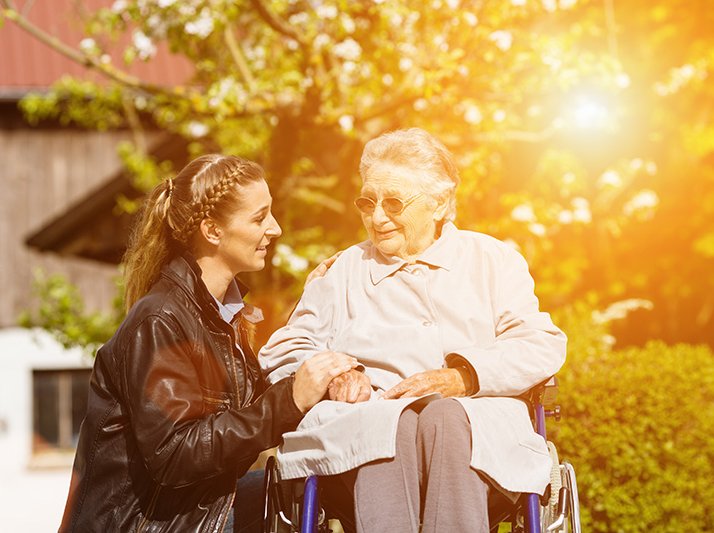 woman visiting grandmother in nursing home